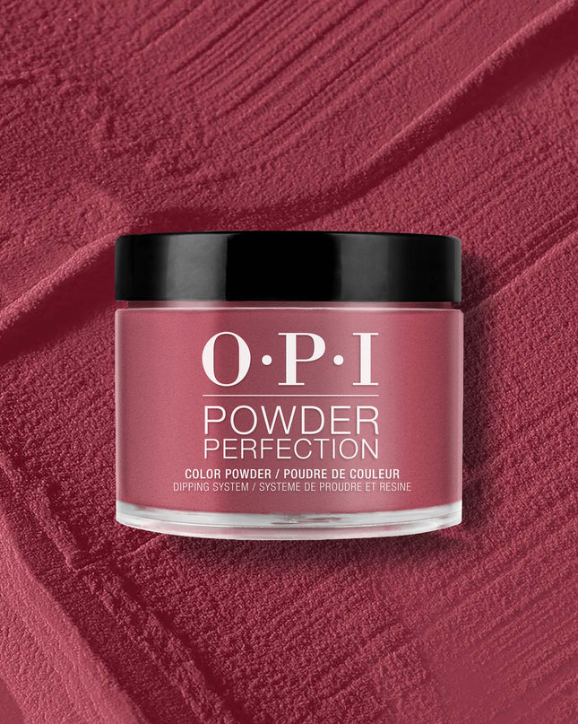 This racy red-violet dipping powder could be your vice.

Nail Powder Perfection is a quick applying, odor-free acrylic alternative that promotes a clean-air environment while offering gel-like shine. Roll up the sleeves of your blazer to show off this shade of pink-red. This dark pink shade of nail polish goes perfectly with hot Miami sunsets.