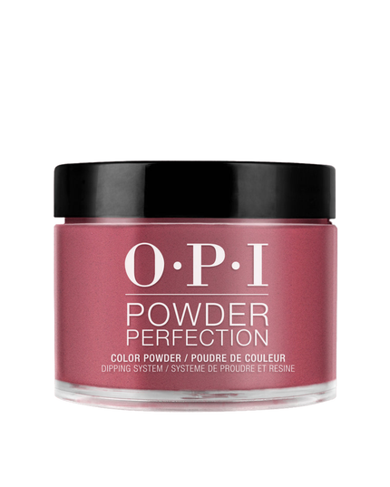 This racy red-violet dipping powder could be your vice.

Nail Powder Perfection is a quick applying, odor-free acrylic alternative that promotes a clean-air environment while offering gel-like shine. Roll up the sleeves of your blazer to show off this shade of pink-red. This dark pink shade of nail polish goes perfectly with hot Miami sunsets.