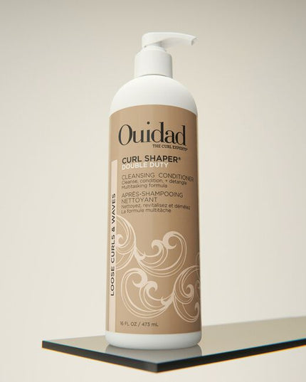 Ouidad's Curl Shaper Double Duty Cleansing Conditioner can be used as a daily conditioner or as a co-wash to cleanse and hydrate hair. This multitasking formula detangles while infusing moisture to encourage definition and add volume without weighing down your curls. When used as a co-wash, the creamy formula gently removes build-up, impurities, and excess oil without stripping your hair. However you choose to use it, rice bran oil and resurrection flower help boost moisture levels to build curl memory.