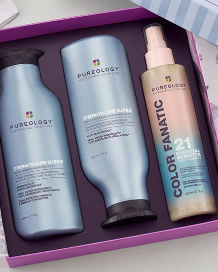 The Pureology Strength Cure Blonde Holiday Kit is a must-have for lightened hair, helping to neutralize brassy tones while repairing damage and preventing future breakage.
