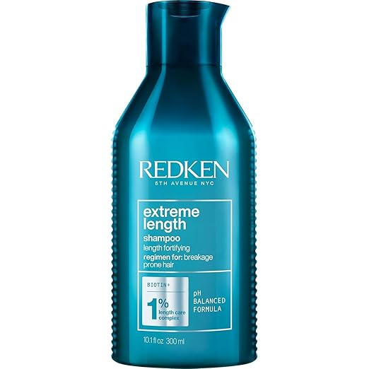 Shampoo with Redken's Length Care Complex featuring Biotin for damaged hair seeking length and strength.