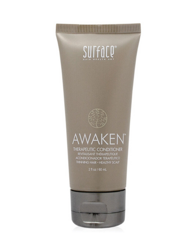 Surface's Awaken Therapuetic Conditioner promotes a healthy scalp and hair. Natural capsicum and menthol stimulate while vegan amaranth, soy and keravis proteins strengthen.
