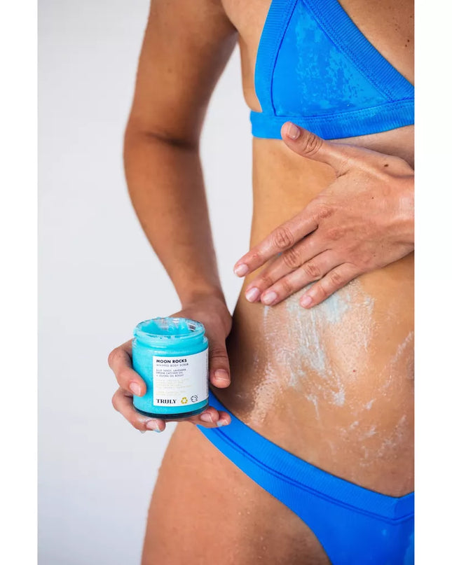 A lightly whipped sugar scrub that delivers brighter, smoother skin instantly. Moon Rocks Body Scrub gently exfoliates to brighten and smooth skin texture while reducing redness. It’s formulated with a nourishing base of 100% organic coconut oil, brightening lavender, and protective vitamin E to buff and brighten up lackluster skin. In a beautifully blue tint, à la ultra moisturizing blue tansy.
