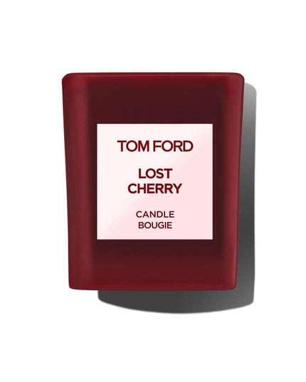 Immerse yourself in the luxurious ambiance of Tom Ford's Lost Cherry Scented Candle, an exquisite creation that transforms any space into a haven of sophistication and allure. Proudly presented by the renowned design house of Tom Ford, this scented candle is a testament to the brand's commitment to elegance and quality. The Lost Cherry fragrance is an enchanting journey, inviting you to experience a blend of seductive, sweet, and rich aromas that captivate the senses.