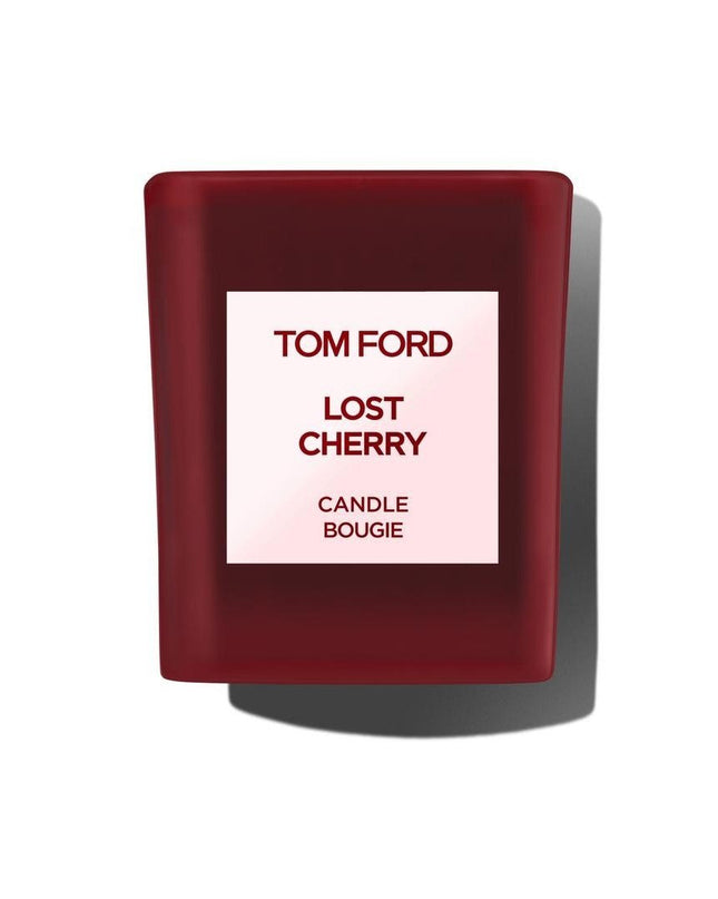 Immerse yourself in the luxurious ambiance of Tom Ford's Lost Cherry Scented Candle, an exquisite creation that transforms any space into a haven of sophistication and allure. Proudly presented by the renowned design house of Tom Ford, this scented candle is a testament to the brand's commitment to elegance and quality. The Lost Cherry fragrance is an enchanting journey, inviting you to experience a blend of seductive, sweet, and rich aromas that captivate the senses.