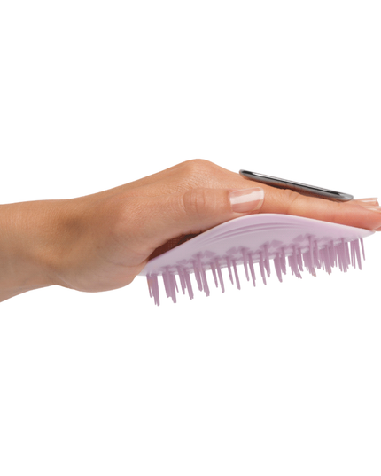 Uniquely designed for fragile hair, the revolutionary Manta brush bends and molds to the shape of your hand and scalp, creating less tension on each strand. Its flexible bristles gently massage the scalp and glide seamlessly through the hair, minimizing breakage and restoring a youthful, silky shine.