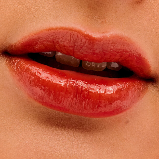 Vacation mode: ON. Take a lip trip to the tropics, where this luscious, longwearing tint awaits you. Glide it on for a splash of moisturizing, kiss-proof color, and a juicy, dewy finish (don't worry, we'll hold your umbrella drink while you get your pool party pout on). It visibly smooths fine lip lines, and the lightweight formula feels balmy and conditioning for all-day comfort. Plus, the custom spoon-shaped applicator easily outlines lips. Another round, anyone?