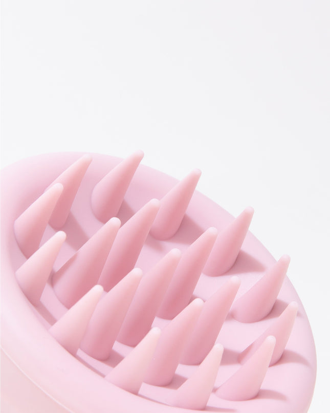 A limited-edition scalp brush designed with soft, flexible bristles to gently cleanse the scalp while evenly distributing shampoo for a refreshing clean. With every use, it provides a soothing massage that helps boost circulation, creating the ideal foundation for strong, beautiful hair. Safe and effective for all hair types, it’s your new must-have for a healthy scalp and effortless shine.